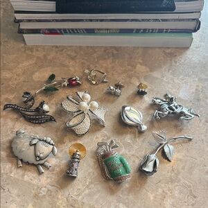 Vintage lot of 12 Silvertone pins and brooches most marked Avon & JJ 1950s-1990s
